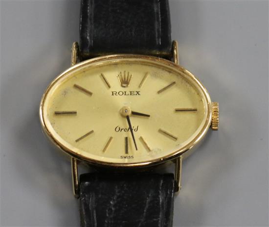 A ladys 18ct gold Rolex Orchid manual wind wrist watch, with oval dial.